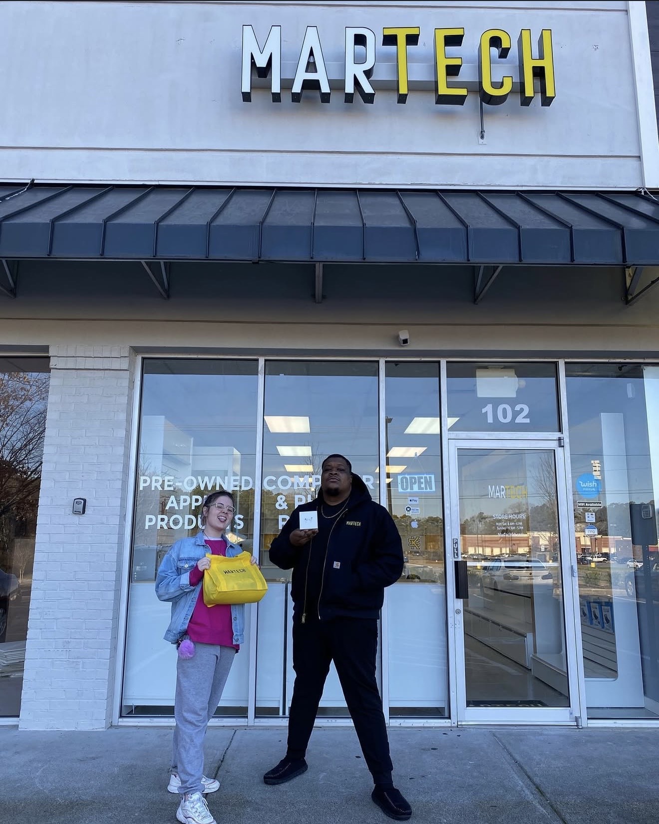 MarTech store front in Kennesaw GA with happy customers