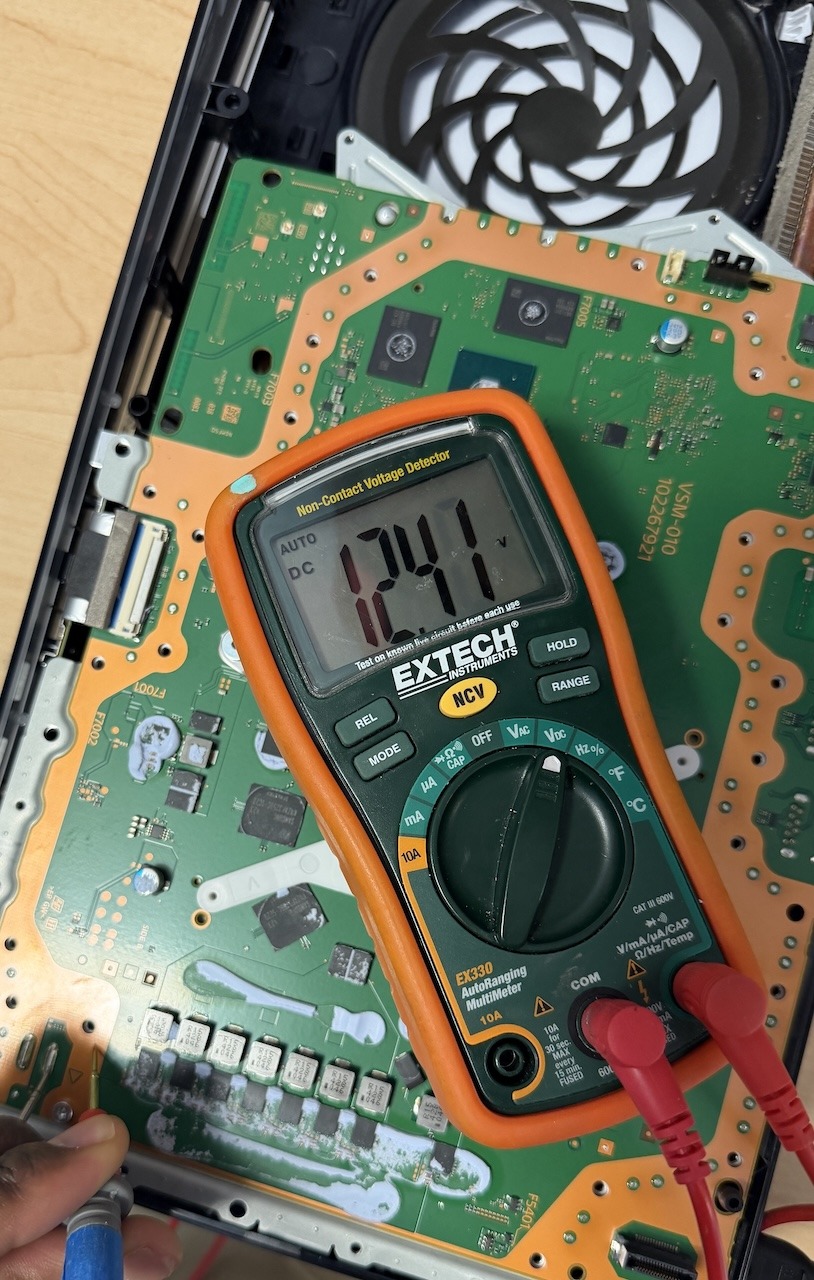 PS5 diagnostic testing with multimeter for repair in Kennesaw GA